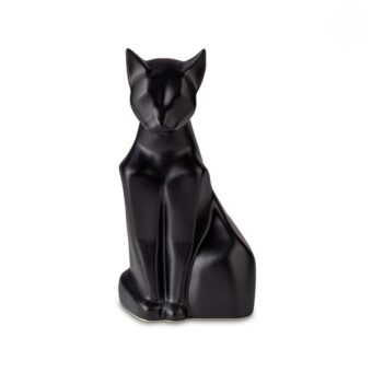 Katten urn mat zwart zittend